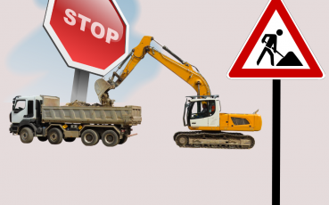 Sprzęt budowlany - cieżaówka i koparka oraz znak stop iuwaga roboty drogowe.